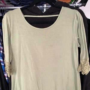 3/4 sleeve Olive green shirt with lace detailing on sleeves, plunge back.